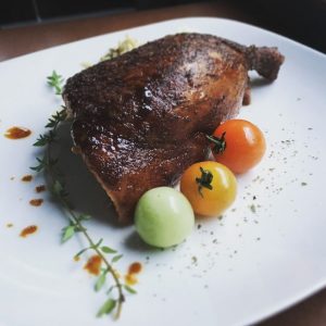 Smoked chicken with herbs and cherry tomatoes