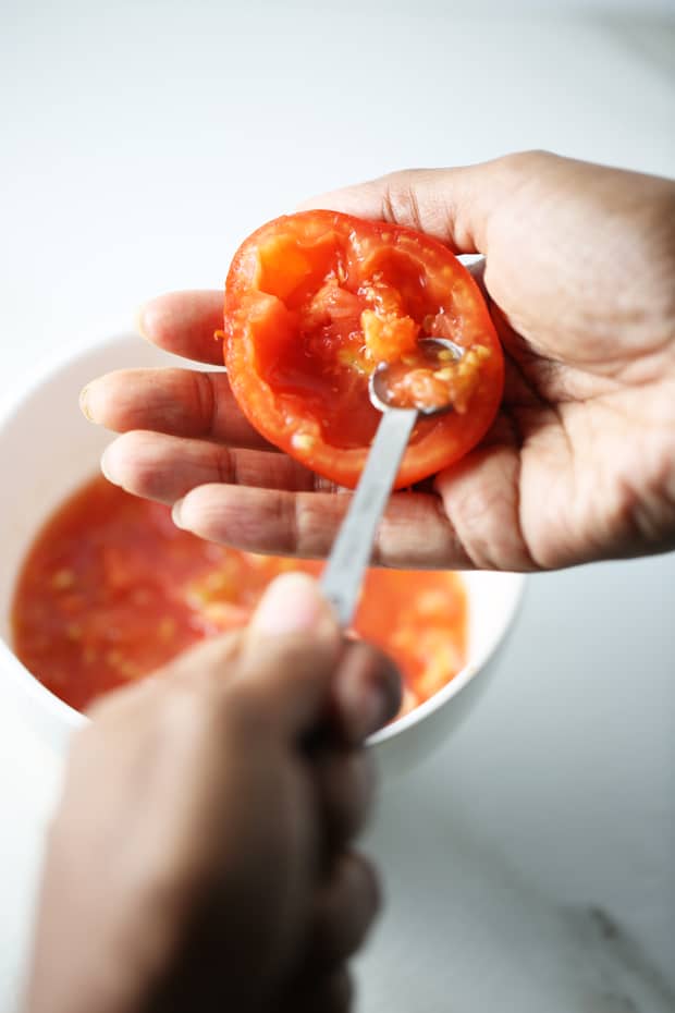 Stuffed tomatoes scooping out