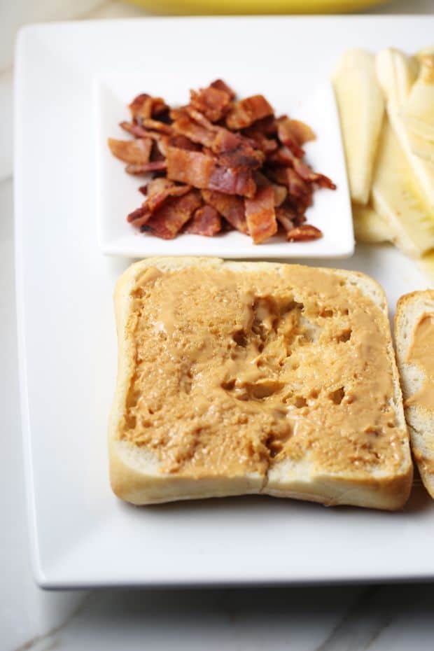 Peanut Butter Banana Bacon Sandwich spread the butter