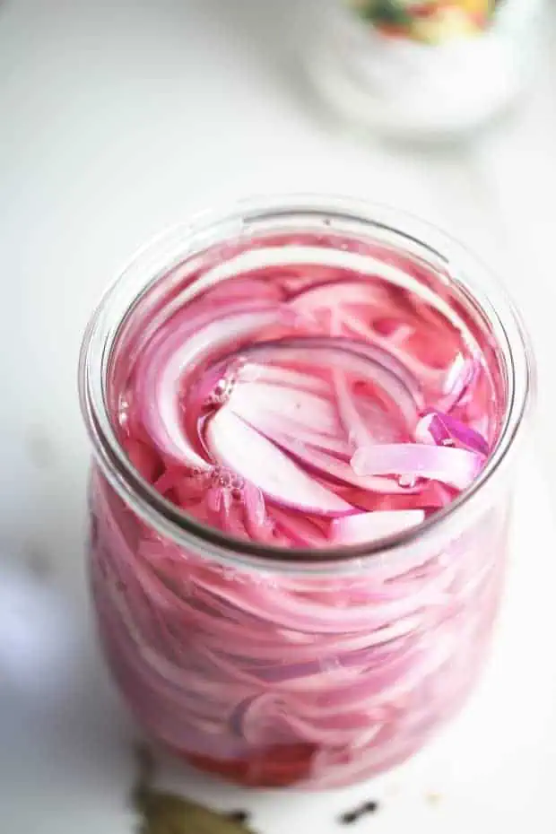 easy red pickled onions in the jar