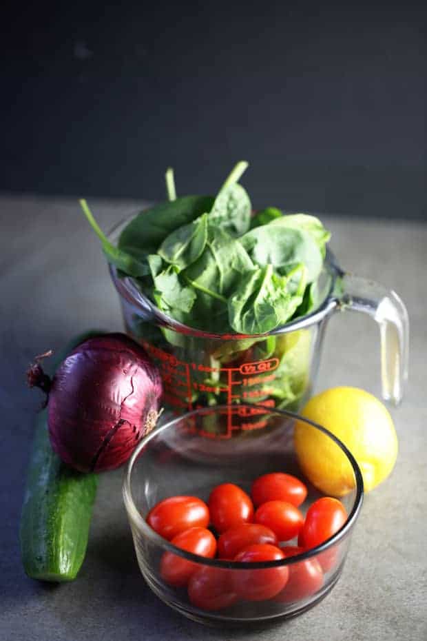 Spinach Cucumber tomato Salad - red onion, spinach, cherry tomato, cucumber, lemon for dressing