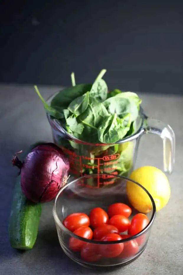 Spinach Cucumber tomato Salad - red onion, spinach, cherry tomato, cucumber, lemon for dressing