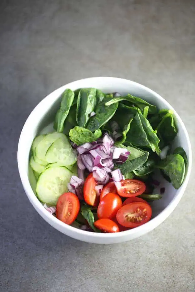 Spinach Cucumber tomato Salad ready for salad dressing